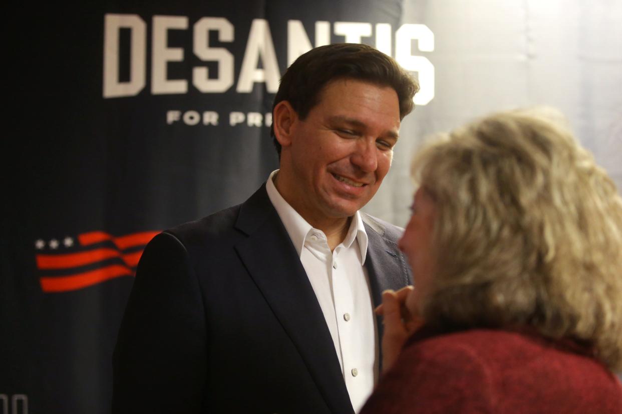 Gov. Ron DeSantis greets attendees of his campaign event Thursday, Dec. 28, 2023 in Marion, Iowa.