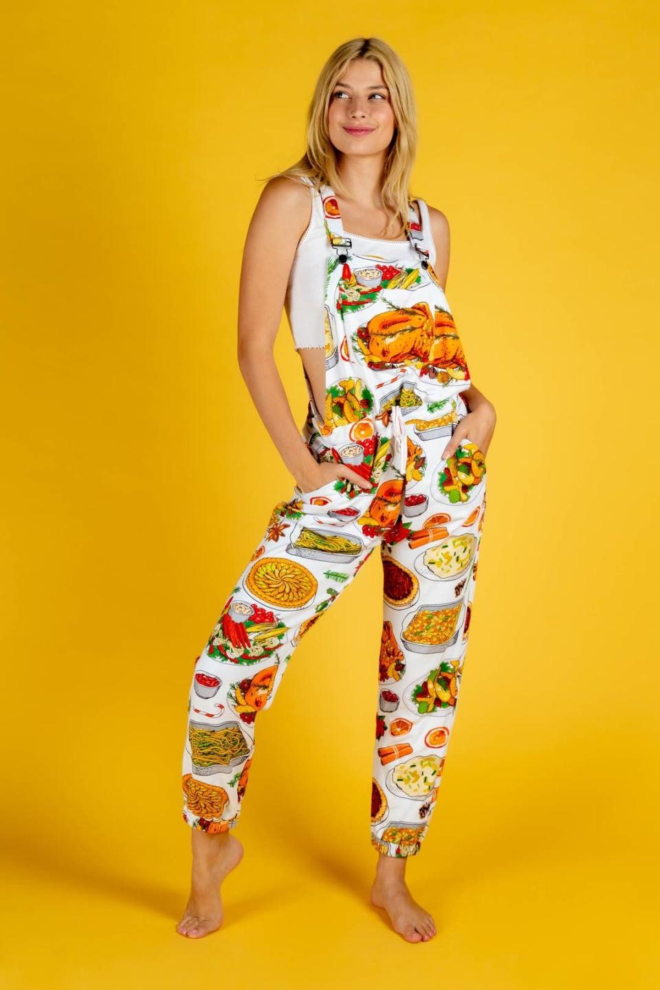 <p><a href="https://go.redirectingat.com?id=74968X1596630&url=https%3A%2F%2Fwww.shinesty.com%2Fproducts%2Fwomens-thanksgiving-feast-holiday-pajamaralls&sref=https%3A%2F%2Fwww.thepioneerwoman.com%2Fholidays-celebrations%2Fg41461827%2Fthanksgiving-pajamas%2F" rel="nofollow noopener" target="_blank" data-ylk="slk:Shop Now;elm:context_link;itc:0;sec:content-canvas" class="link ">Shop Now</a></p><p>Womens White Thanksgiving Pajamaralls</p><p>shinesty.com</p><p>$84.99</p><span class="copyright">Shinesty</span>