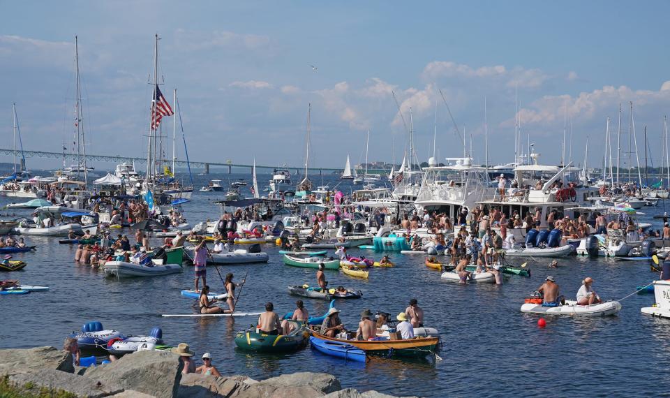 Boats line water on Narragansett Bay to watch the Newport Folk Festival on Saturday.