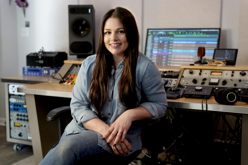 Gena Johnson poses in her home studio in Nashville, Tenn. on April 8, 2021. Johnson, a recording engineer, is the first woman to ever be nominated for engineer of the year by the Academy of Country Music. (AP Photo/Mark Humphrey)