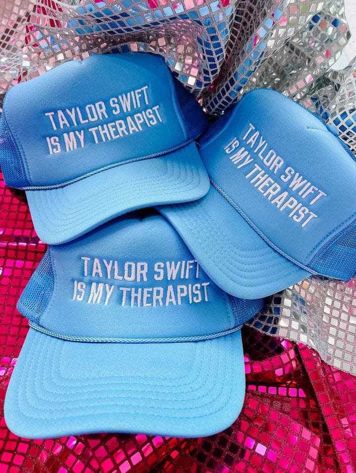 The "Taylor Swift is my therapist" trucker hat is sold at the Gasp Happy Store.