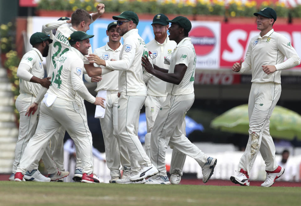 South Africa's Anrich Nortje, second left, celebrates with teammates the dismissal of India's captain Virat Kohli during the third and last cricket test match between India and South Africa in Ranchi, India, Saturday, Oct. 19, 2019. (AP Photo/Aijaz Rahi)