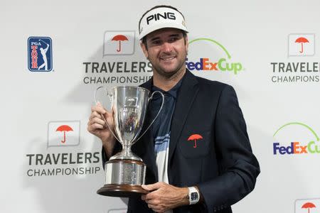 Jun 24, 2018; Cromwell, CT, USA; Bubba Watson holds the championship trophy after winning the Travelers Championship at TPC River Highlands. Mandatory Credit: Bill Streicher-USA TODAY Sports