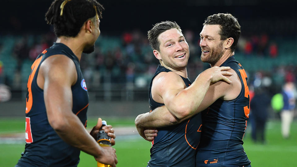 Toby Greene, pictured here celebrating with teammates after GWS' win over Sydney. 