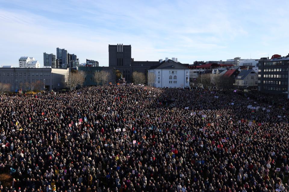 People across Iceland gather during the women's strike in Reykjavik, Iceland, on Tuesday. Iceland's prime minister and women across the island nation are on strike to push for an end to unequal pay and gender-based violence.