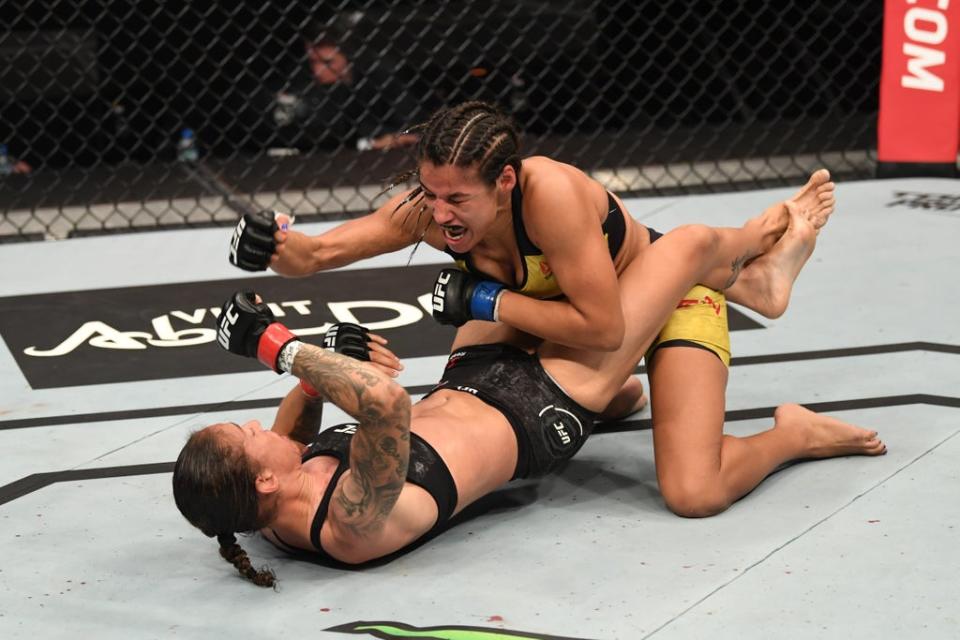 Julianna Pena (top) during her fight against Germaine de Randamie (Zuffa/LLC via Getty Images)
