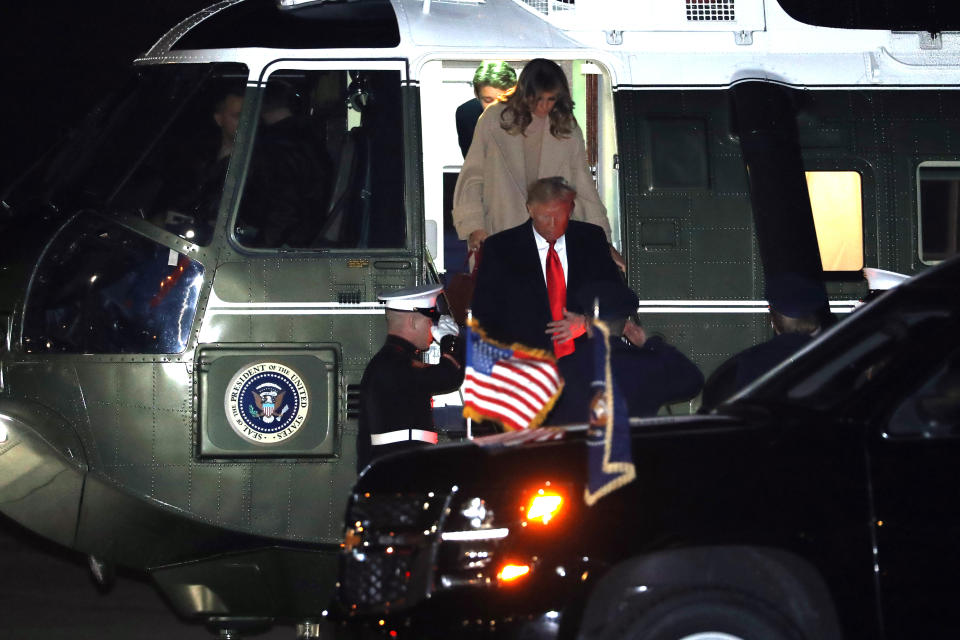 President Donald Trump, first lady Melania Trump and Barron Trump arrive at Andrews Air Force Base, Md., Friday, Dec. 20, 2019, before traveling to Mar-a-lago in Palm Beach, Fla. (AP Photo/Andrew Harnik)