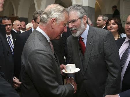 Britain's Prince Charles (L) shakes hands with Gerry Adams at the National University of Ireland in Galway, Ireland May 19, 2015. REUTERS/Brian Lawless/pool