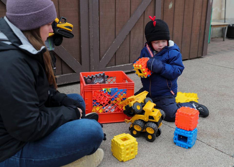 Cooper Cousins builds a tower of blocks on Nov. 14 at the University of Wisconsin-Stevens Point Child Learning & Care Center in Stevens Point.