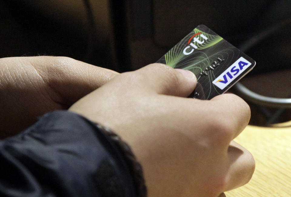 FILE - In this May 9, 2012 file photo, a Visa credit card is tendered at opening of the Superdry store in New York's Times Square. If you do not have a credit history it becomes more difficult to obtain a credit card, a loan or even an apartment. (AP Photo/Richard Drew, File)