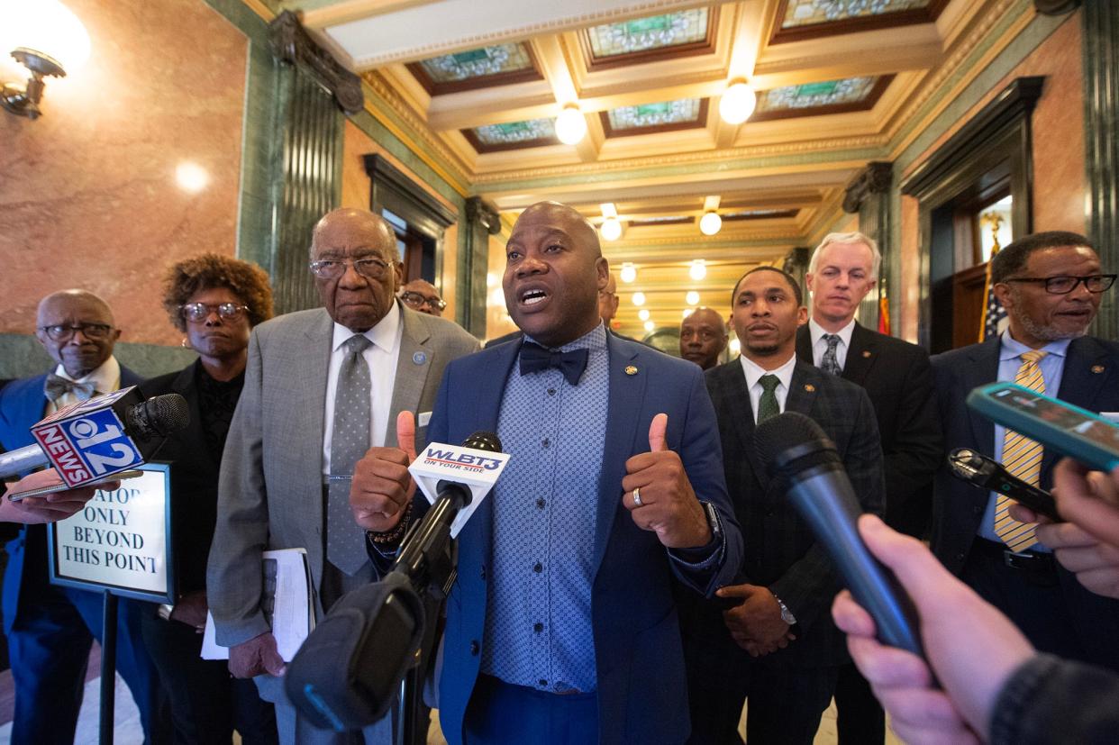 Sen. Derrick Simmons, D-Greenville, center, and Senate Black Caucus members, address media after the Mississippi Senate passed its version of the Medicaid expansion bill at the state Capitol in Jackson on Thursday. "It's not perfect," Simmons said, but it's something and the caucus will continue to push for further Medicaid expansion."