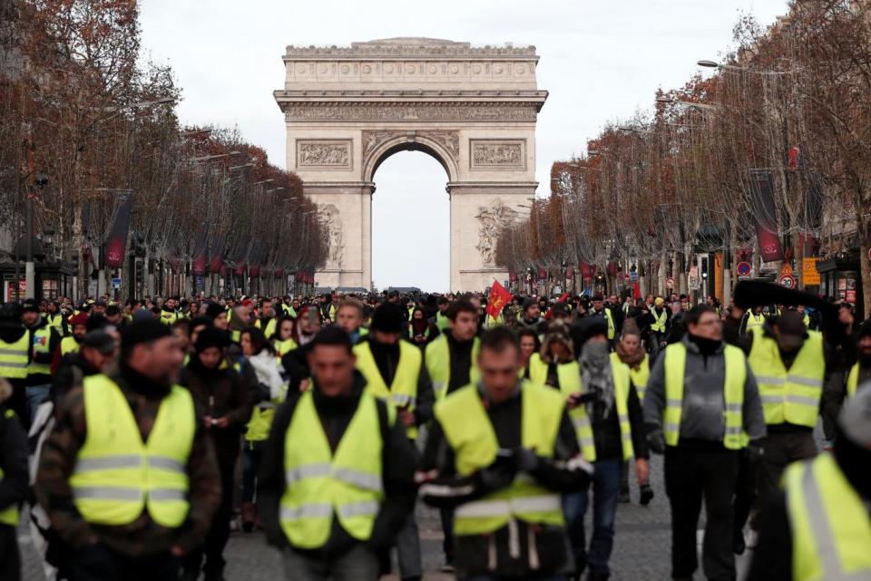 Protesters wearing yellow vests demonstrating (Benoit Tessier/Reuters)