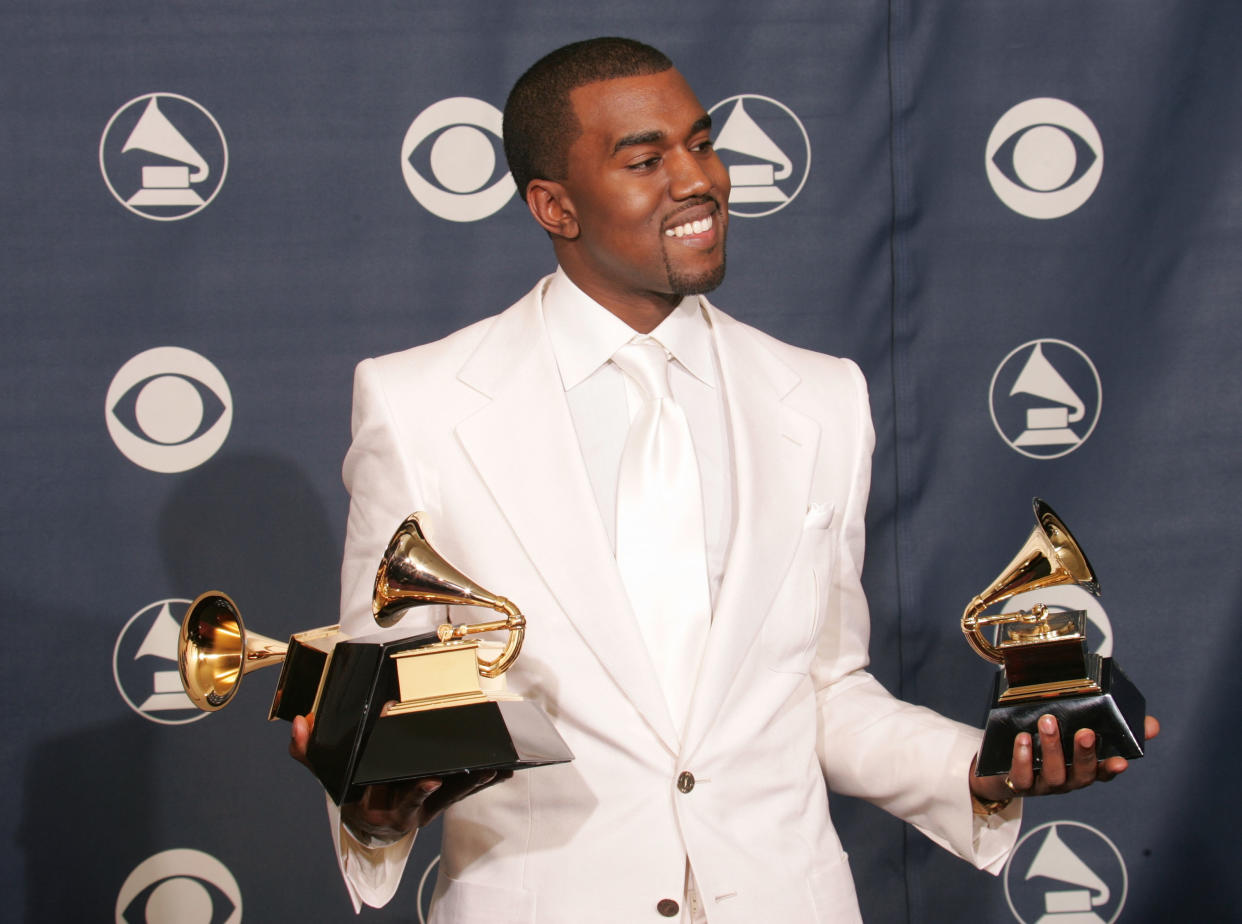LOS ANGELES - FEBRUARY 13:  Kanye West poses backstage with his awards for 