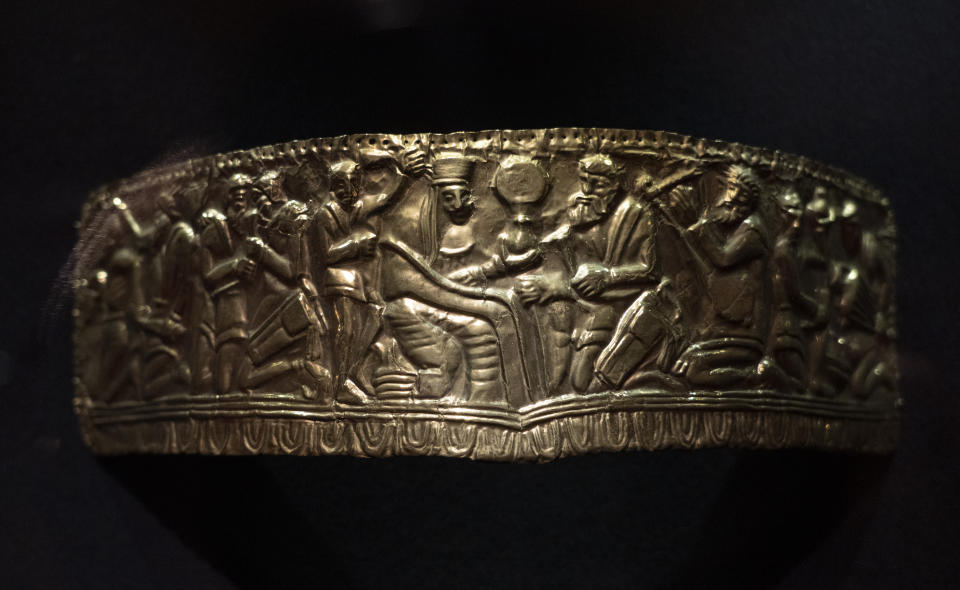 A copy of the fourth century B.C. golden diadem, an ancient treasure from a Scythian burial mound, is exhibited in the Museum of Historical Treasures in Kyiv, Ukraine, Friday, Sept. 2, 2022. Fearing Russian troops would storm the city, museum employees dismantled exhibits, carefully packing away artifacts into boxes for evacuation. For now, the museum is just showing copies. (AP Photo/Efrem Lukatsky)