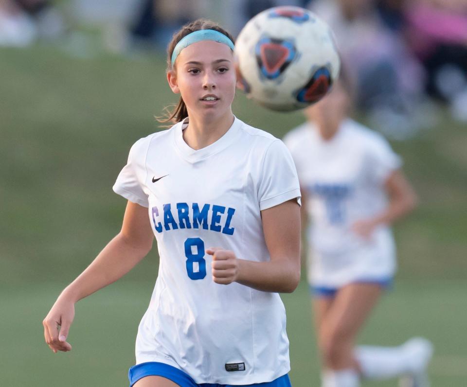 Olivia Cebalo (8) of Carmel watches as a ball goes by on Thursday, Oct. 6, 2022, at Westfield High School. 