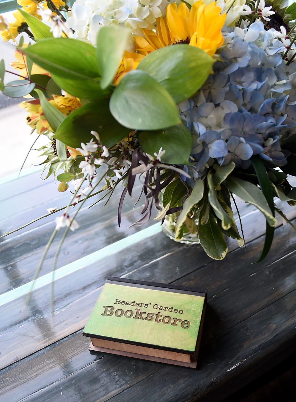 A miniature example of the new sign for Reader's Garden Bookstore. After nearly 20 years on Broadway, the Reader's Garden Bookstore is moving locations in Granville. It will now be on Prospect Street in the former SteamRoller Bagel shop.