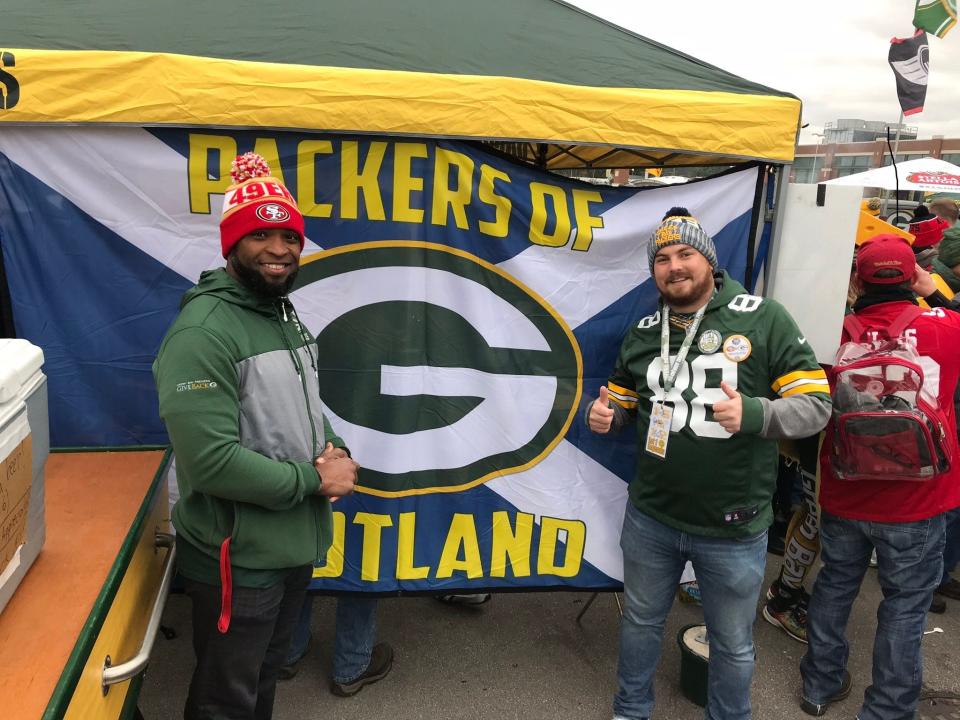 Bryan Weir of Edinburgh, Scotland, right, poses with another fan at Lambeau Field. Weir is among European Packers fans who are elated that Green Bay will play in London during the 2022 season.
