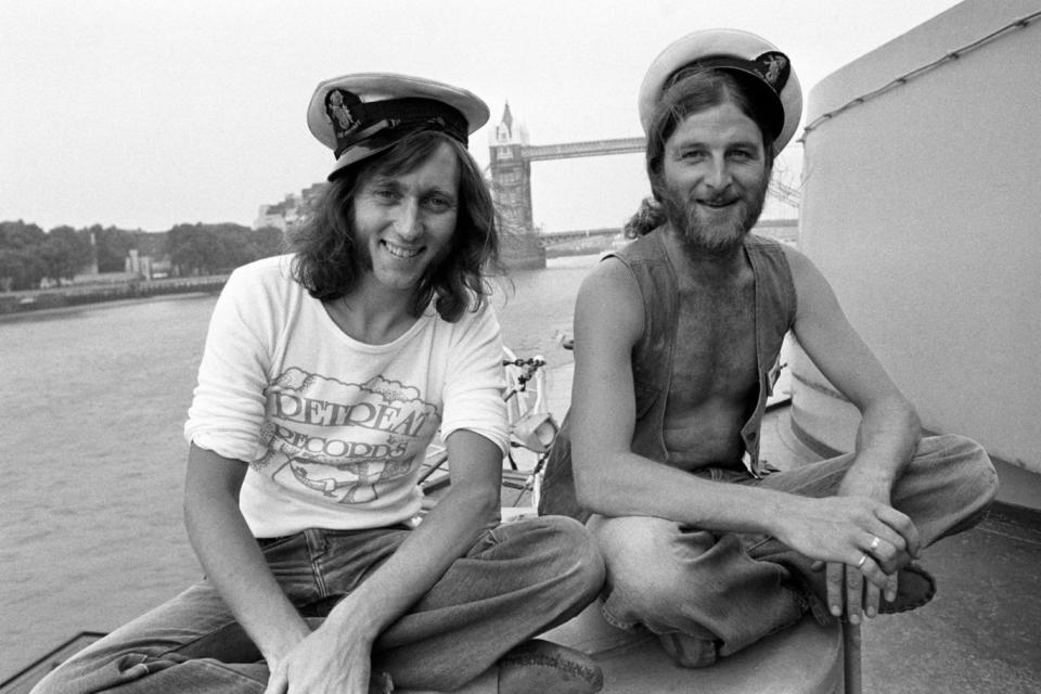 Chas right, and Dave Peacock pictured together on HMS Belfast in 1975 (PA)