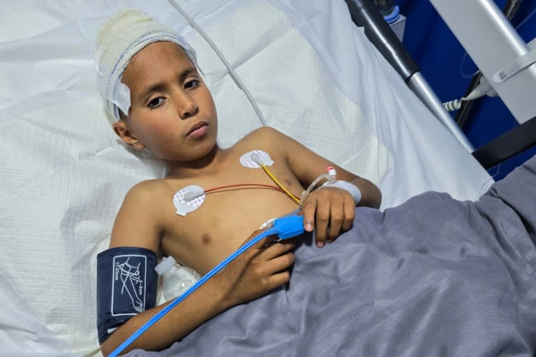 Mohamed Farhat, 10, is treated in a Tripoli hospital for injuries caused by an unexploded ordnance (Mahmud TURKIA)