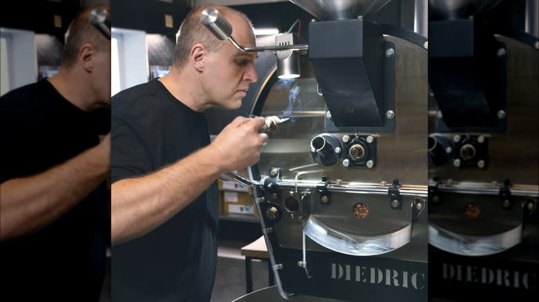 Man roasting coffee beans with Diedrich machine