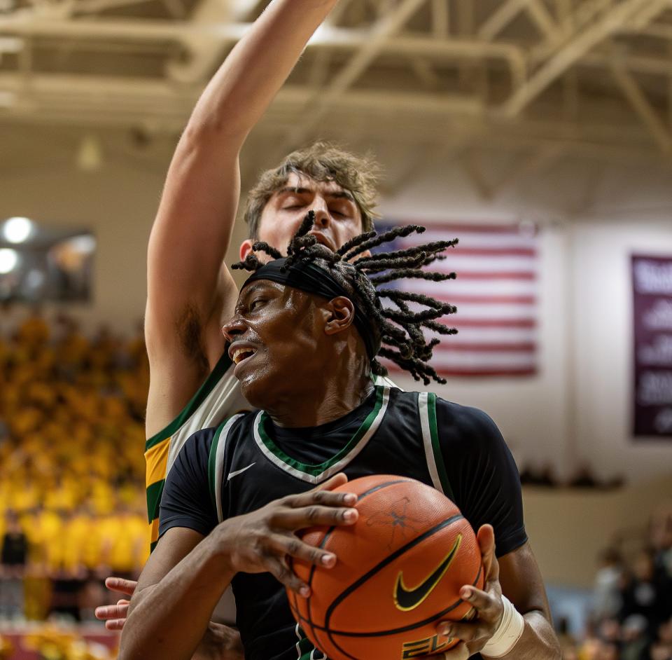 Trinity center Julius Edmonds (0) worked the baseline as the Trinity Shamrocks faced rival St. Xavier Tigers at Knights Hall on the Bellarmine campus on Friday night.  Trinity defeated Saint Xavier 81-59.  January 26, 2024