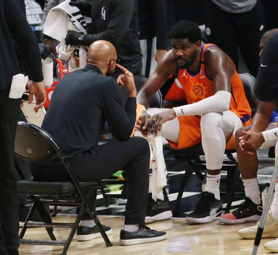 Phoenix Suns head coach Monty Williams talks to center Deandre Ayton (22) during a timeout with the LA Clippers during Game 6 at STAPLES Center on June 30, 2021.