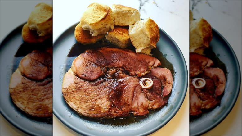 Country ham on plate with biscuits
