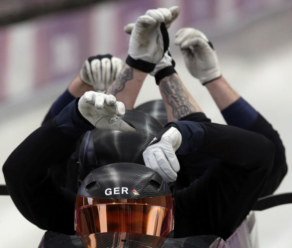 The team from Germany, piloted by Maximilian Arndt, start a run during the men's four-man bobsled training at the 2014 Winter Olympics, Feb. 20, 2014, in Krasnaya Polyana, Russia.
