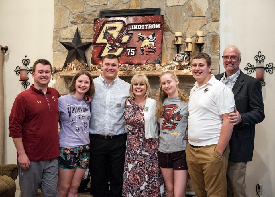 Former Shepherd Hill football coach Chris Lindstrom, far right, poses with his family as his son Chris, third from left, was selected in the first round of the NFL Draft by the Atlanta Falcons in 2019.