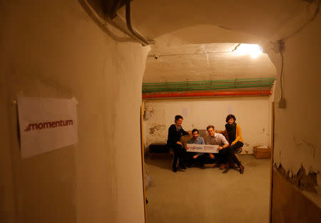 Edina Pottyondy, Andras Fekete-Gyor, Miklos Hajnal and Anna Orosz, leading members of political movement Momentum which challenges Budapest's 2024 Olympic bid with a referendum, sit on a sofa at Momentum's headquarters, located in a basement in Budapest, Hungary, February 20, 2017. REUTERS/Laszlo Balogh