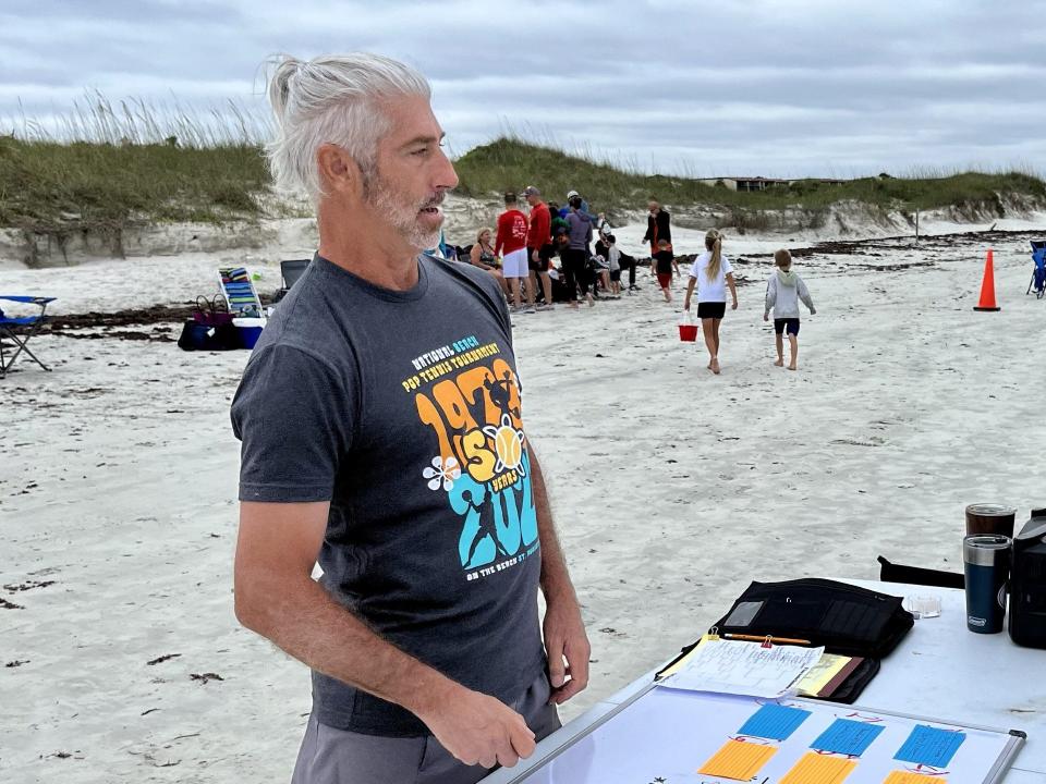 National Beach Pop Tennis Tournament director Frank Morrison oversees the matches played at Butler Beach during Memorial Day weekend.