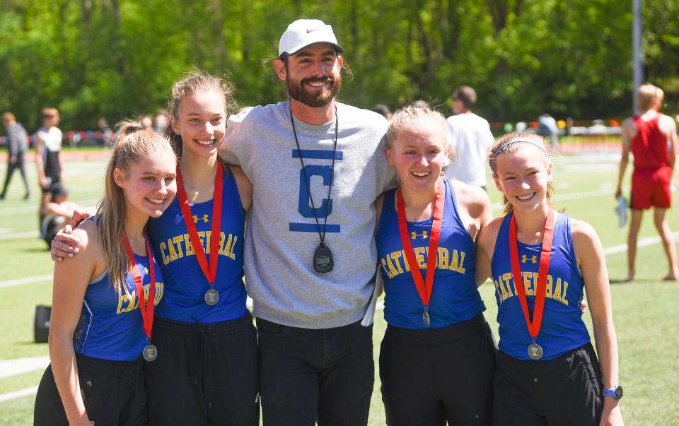 Cathedral's 4x800m relay team celebrates qualifying for state Wednesday, June 1, 2022, at the Section 5A track and field meet at St. John's. 