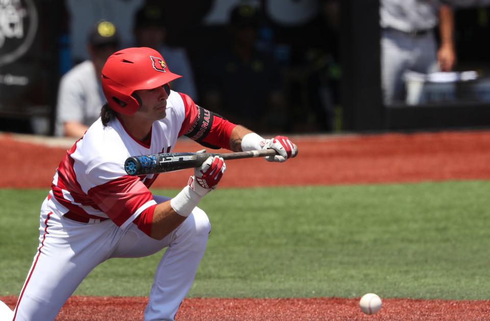 U of L's Logan Beard (2) hit a sacrifice bunt to advance runners on base against Oregon during NCAA Regional play at Jim Patterson Stadium in Louisville, Ky. on June 5, 2022.