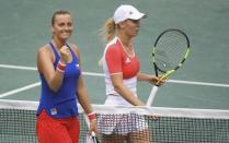 2016 Rio Olympics - Tennis - Preliminary - Women's Singles Second Round - Olympic Tennis Centre - Rio de Janeiro, Brazil - 08/08/2016. Petra Kvitova (CZE) of Czech Republic celebrates next to Caroline Wozniacki (DEN) of Denmark after winning their match. REUTERS/Toby Melville