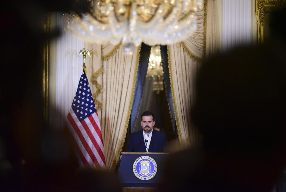 Puerto Rico governor Ricardo Rossello holds a press conference, almost two days after federal authorities arrested the island's former secretary of education and five other people on charges of steering federal money to unqualified, politically connected contractors, in San Juan, Puerto Rico, Thursday, July 11, 2019. At the time of the arrests, Rossello was in the middle of a family vacation in France, which he canceled to travel back to the Island. U.S. Attorney for Puerto Rico Rosa Emilia Rodríguez said Gov. Ricardo Rossello was not involved in the investigation. (AP Photo/Carlos Giusti)