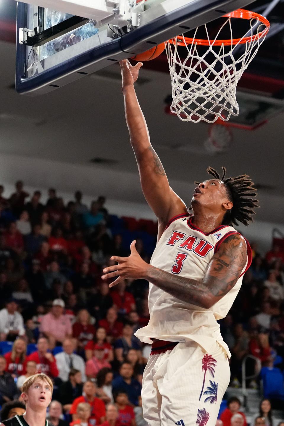 Former Palm Beach Lakes standout Giancarlo Rosado, going up for a layup during Tuesday night's win, remembers when the Owls played before a lot of empty seats at Baldwin Arena.