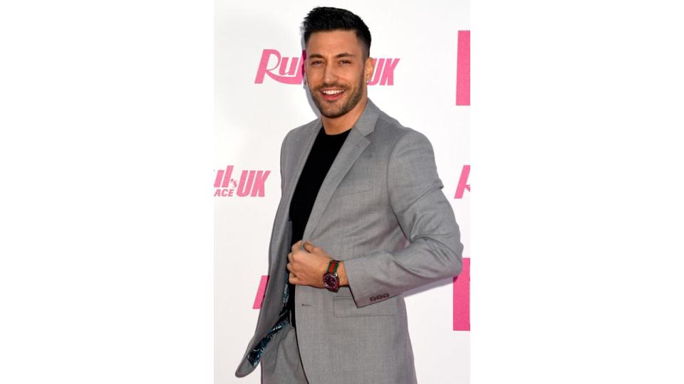 Giovanni Pernice in a grey jacket and black shirt