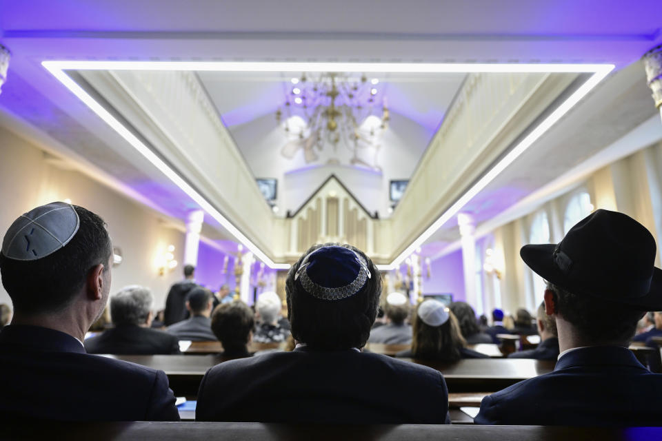 People attend the commemoration ceremony for the 85th anniversary of the Night of Broken Glass (Kristallnacht) will take place in Berlin, Thursday, Nov. 9, 2023 in Berlin. (John MacDougall, Pool via AP)