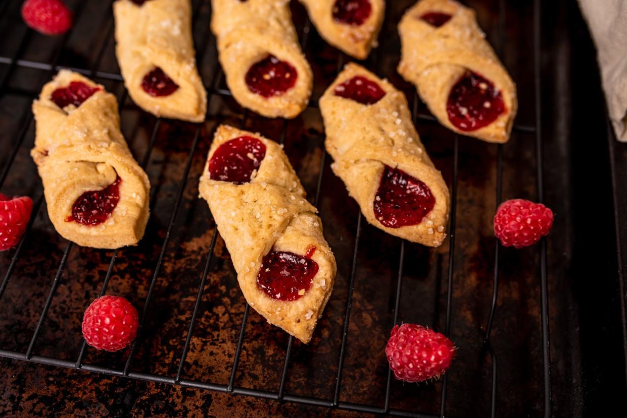 Kolacky with Raspberry. Pastry with jelly and cream. Polish Kolaczki cookies, freshly baked