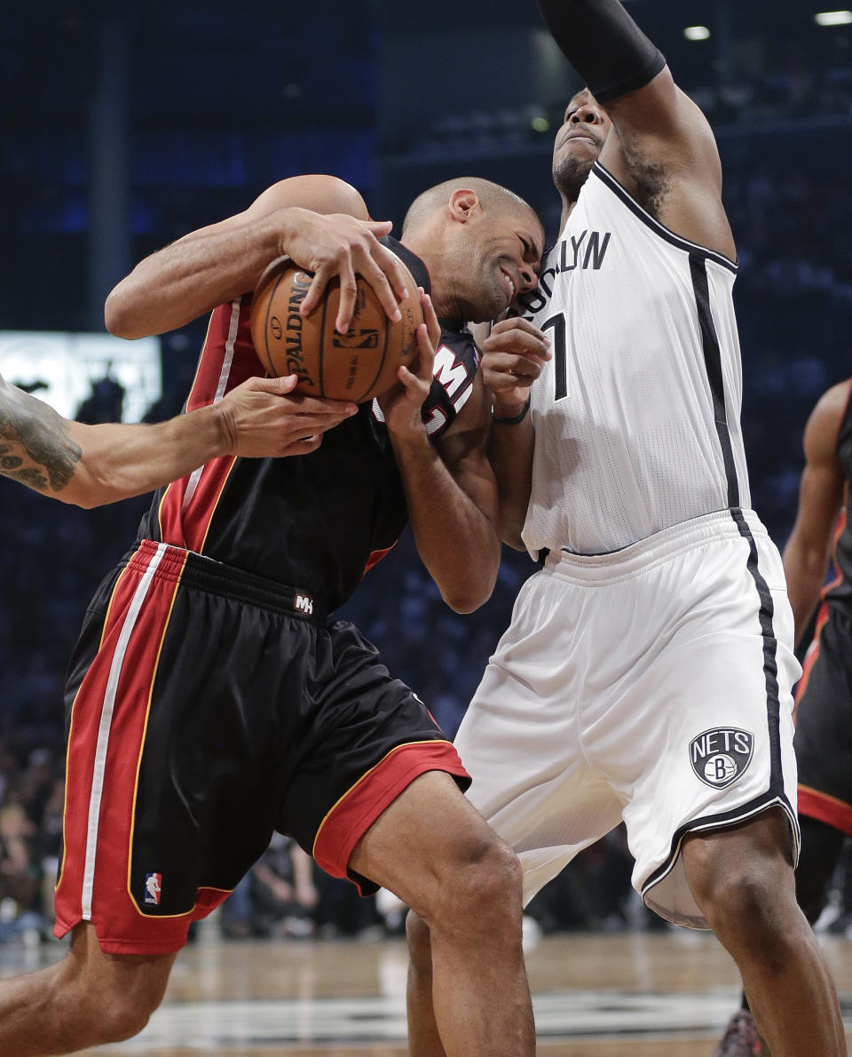 Miami Heat forward Shane Battier drives against Brooklyn Nets forward Mason Plumlee (1) in the second period during Game 3 of an Eastern Conference semifinal NBA playoff basketball game on Saturday, May 10, 2014, in New York. (AP Photo/Julie Jacobson)