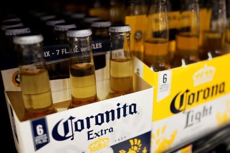 Bottles of the beer, Corona, a brand of Constellation Brands Inc., sit on a supermarket shelf in Los Angeles, California April 1, 2015. REUTERS/Lucy Nicholson/File Photo