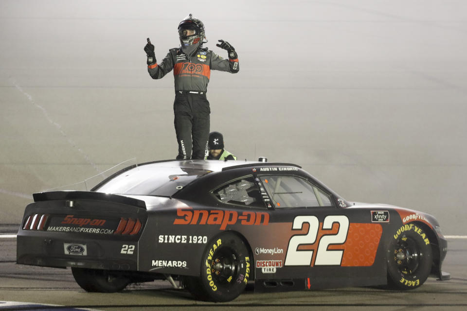 Austin Cindric (22) celebrates after winning a NASCAR Xfinity Series auto race Friday, July 10, 2020, in Sparta, Ky. (AP Photo/Mark Humphrey)