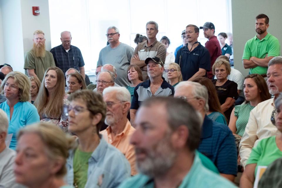 A standing room-only crowd attends a Planning Board meeting in Escambia County on Thursday, July 13, 2023, to voice their opposition to a proposed residential development in the Molino area. 