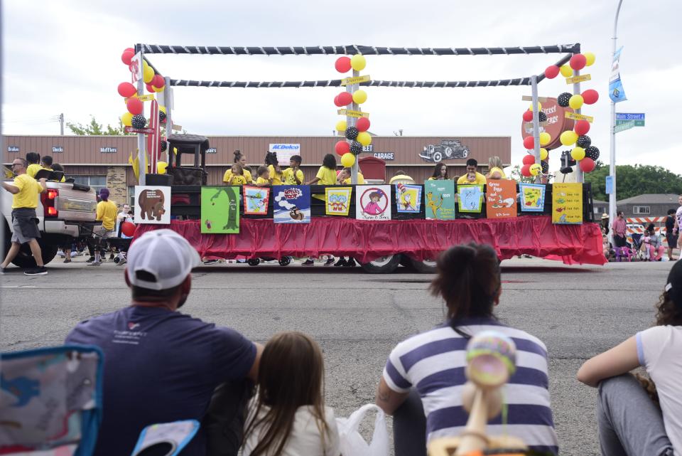 A parade float decorated in different popular children's books drives throughout Huron Avenue during the annual Rotary International Day Parade to kick off Port Huron's Boat Week on Wednesday, July 13, 2022.