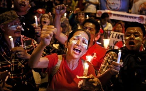 Supporters of Indonesia's Christian governor, "Ahok", protest his conviction in May 2017 for blasphemy - Credit: Dita Alangkara/AP