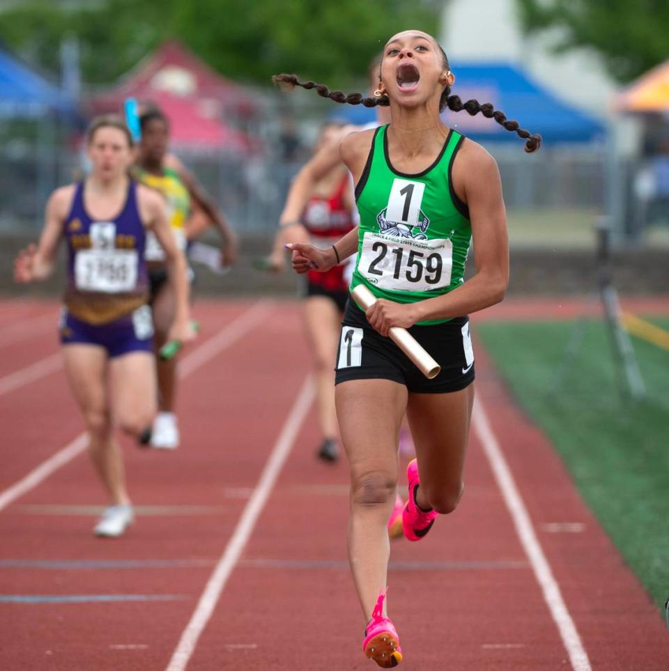 Tumwater’s Ava Jones erupts in joy as she crosses the finish line to give the T-Birds the state title in the 2A girls 4x200 relay during the final day of the WIAA state track and field championships at Mount Tahoma High School in Tacoma, Washington, on Friday, May 26, 2023.