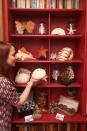 A model looks at edible ornaments at the cake hotel. One lucky couple, who won a night's stay through a competition, will be able to eat their way through vanilla sponge cushions, windows and walls clad with 2,000 macaroons, 20 kilos of marshmallow garlands, windowsills built entirely from fudge and a bath filled with caramel-coated popcorn (PA)