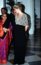 <p>For an evening event during her tour of India in 1992, Princess Diana wore a black and silver embroidered dress by Chaterine Walker, which has since been sold at auction. <i>[Photo: Rex]</i><br></p>