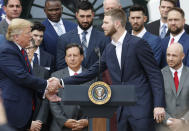 President Donald Trump, left, shakes hands with pitcher Chris Sales, right, during a ceremony on the South Lawn of the White House in Washington, Thursday, May 8, 2019, where Trump honored the 2018 World Series Baseball Champion Boston Red Sox. (AP Photo/Pablo Martinez Monsivais)