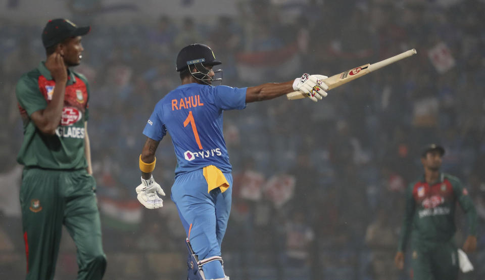 India's K.L. Rahul raises his bat after scoring fifty runs during third Twenty20 international cricket match against Bangladesh in Nagpur, India, Sunday, Nov. 10, 2019. (AP Photo/Rafiq Maqbool)